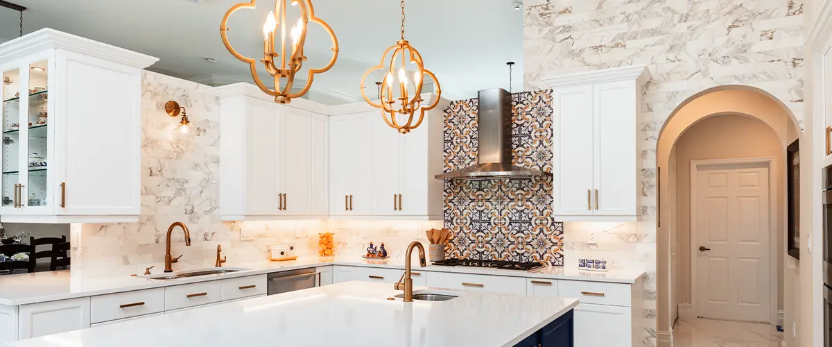 Modern kitchen with gray cabinets, large island, and pendant lighting